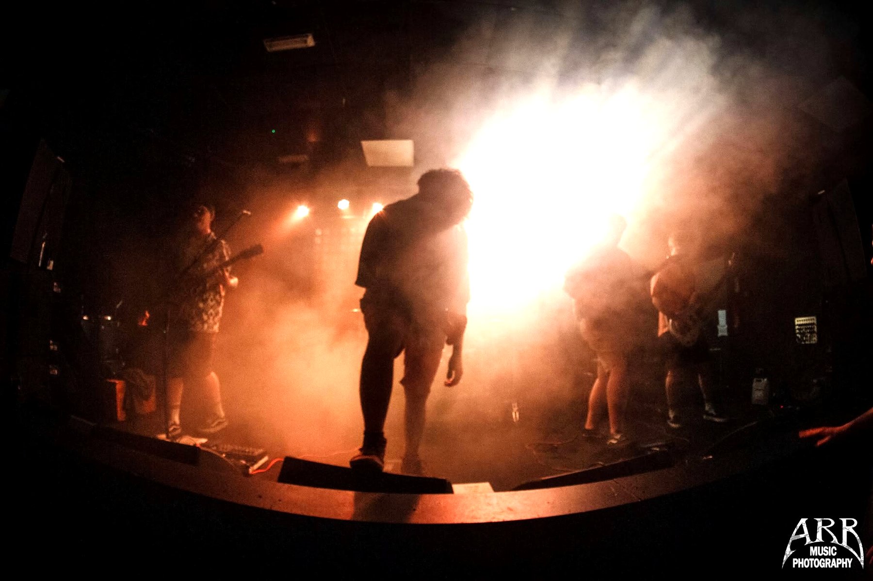 Bound by Burdens performing live on stage in smoke and stage light